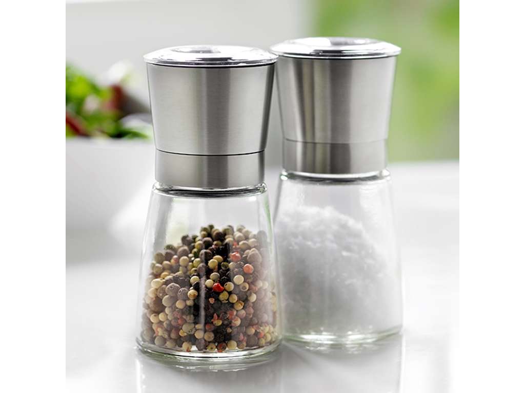Salt and pepper grinder in glass with steel lid